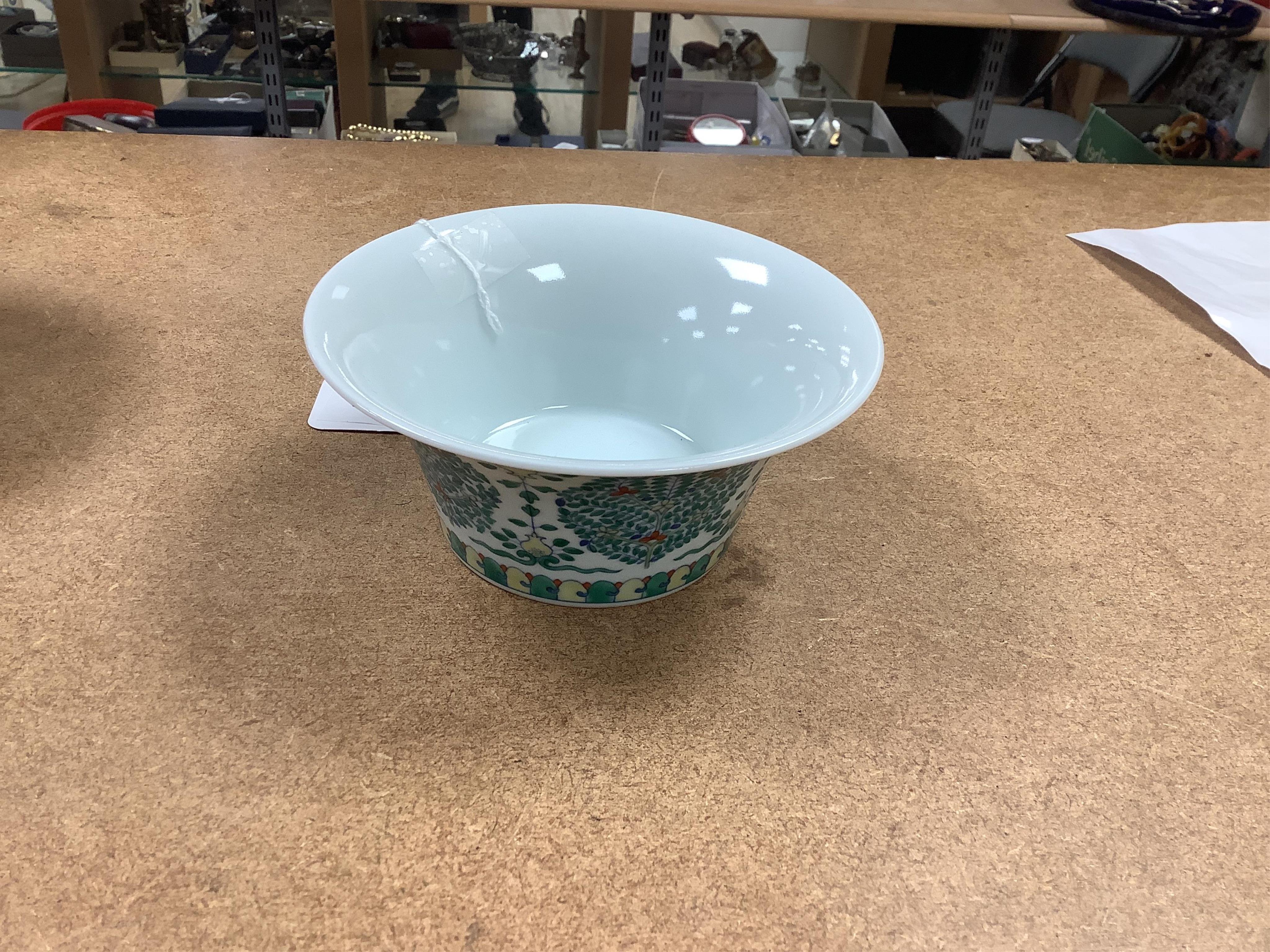 A Chinese blue and white bowl, Kangxi, 15cm. diam., a famille rose teapot stand, Yongzheng, and two doucai bowls. Condition - varies